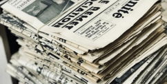 bundle of newspaper on table